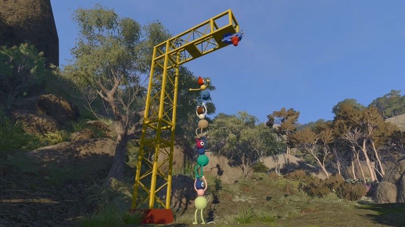 A stack of characters climbing a tall scaffolding tower against a blue sky