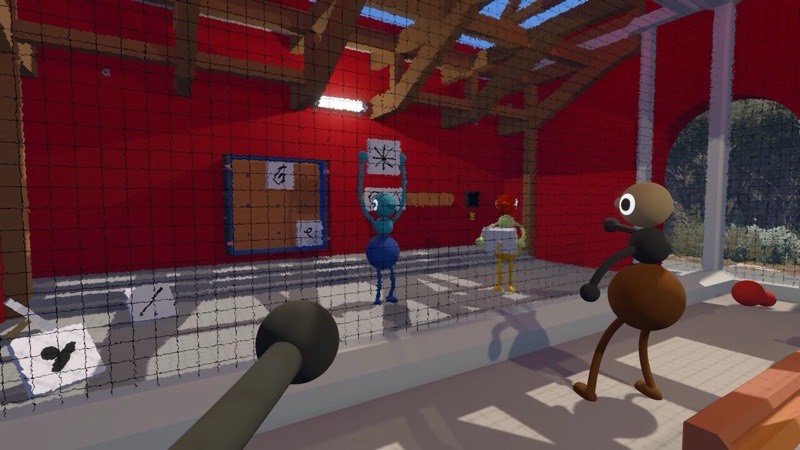 A character walks through a red barn-like room with a chain-link fence and taped-up notes